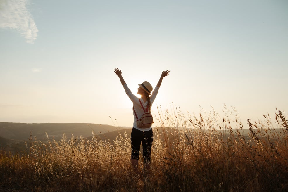 Girl raised her hands to the sky